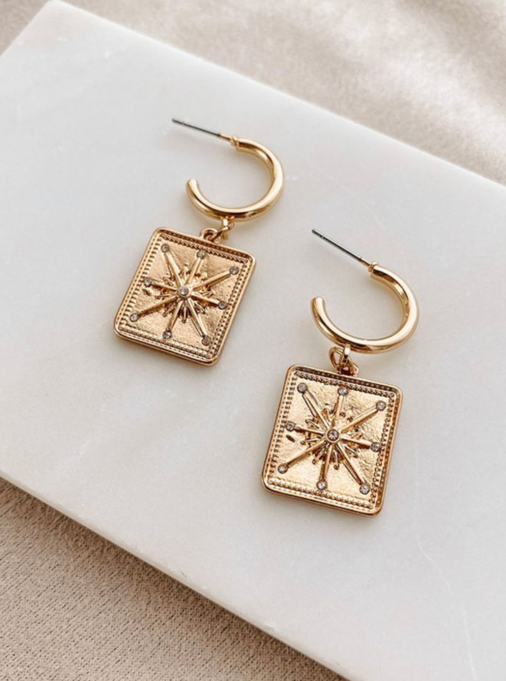 Star charm earrings